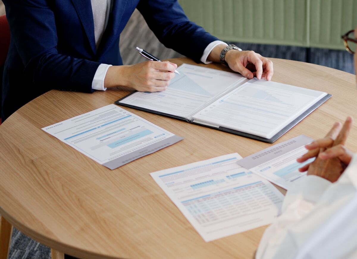 A businessman selling to elderly people
